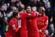 LIVERPOOL, ENGLAND - DECEMBER 21: Luis Suarez (2nd right) of Liverpool celebrates with team mates after scoring during the Barclays Premier League match between Liverpool and Cardiff City at Anfield on December 21, 2013 in Liverpool, England. (Photo by