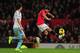 MANCHESTER, ENGLAND - DECEMBER 21: Javier Hernandez of Manchester United competes with James Tomkins of West Ham United during the Barclays Premier League match between Manchester United and West Ham United at Old Trafford on December 21, 2013 in Manches