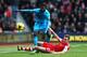 SOUTHAMPTON, ENGLAND - DECEMBER 22: Emmanuel Adebayor of Spurs is tackled by Calum Chambers of Southampton during the Barclays Premier League match between Southampton and Tottenham Hotspur at St Mary's Stadium on December 22, 2013 in Southampton, Englan