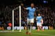MANCHESTER, ENGLAND - DECEMBER 14: Fernandinho of Manchester City celebrates scoring their fifth goal past Wojciech Szczesny of Arsenal during the Barclays Premier League match between Manchester City and Arsenal at Etihad Stadium on December 14, 2013 in