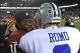 Dec 30, 2012; Landover, MD, USA; Washington Redskins quarterback Robert Griffin III (10) talks with Dallas Cowboys quarterback Tony Romo (9) after the game at FedEX Field. The Redskins won 28 - 18. Mandatory Credit: Brad Mills-USA Today Sports