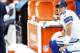 Dec 22, 2013; Landover, MD, USA; Dallas Cowboys quarterback Tony Romo (9) watches from the bench against the Washington Redskins in the fourth quarter at FedEx Field. The Cowboys won 24-23. Mandatory Credit: Geoff Burke-USA TODAY Sports
