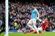 MANCHESTER, ENGLAND - DECEMBER 14: Laurent Koscielny of Arsenal fails to stop Alvaro Negredo of Manchester City scoring their second goal during the Barclays Premier League match between Manchester City and Arsenal at Etihad Stadium on December 14, 2013