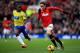 MANCHESTER, ENGLAND - DECEMBER 07: Adnan Januzaj of Manchester United is pursued by Vurnon Anita of Newcastle during the Barclays Premier League match between Manchester United and Newcastle United at Old Trafford on December 7, 2013 in Manchester, Engla