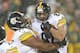 GREEN BAY, WI - DECEMBER 22: Matt Spaeth #87 of the Pittsburgh Steelers is lifted up in the air by teammate Marcus Gilbert #77 after catching a touchdown pass against the Green Bay Packers at Lambeau Field on December 22, 2013 in Green Bay, Wisconsin. The