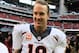 HOUSTON, TX - DECEMBER 22: Peyton Manning #18 of the Denver Broncos celebrates as he walks off the field after setting the NFL record for touchdown passes in a season with 51 in a 37-13 defeat of the Houston Texans at Reliant Stadium on December 22, 2013
