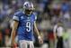 Dec 22, 2013; Detroit, MI, USA; Detroit Lions quarterback Matthew Stafford (9) looks down during overtime against the New York Giants at Ford Field. Giants beat the Lions 23-20. Mandatory Credit: Raj Mehta-USA TODAY Sports