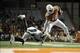 Nov 28, 2013; Austin, TX, USA; Texas Longhorns quarterback Tyrone Swoopes (18) runs the ball against Texas Tech Red Raiders defensive back Tre' Porter (5)during the second half at Darrell K Royal-Texas Memorial Stadium. Texas beat Texas Tech 41-16. Mandat