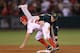 ANAHEIM, CA - SEPTEMBER 11: Second baseman Cliff Pennington #2 of the Oakland Athletics forces Peter Bourjos #25 of the Los Angeles Angels of Anaheim out at second before throwing to first to complete the double play in the ninth inning at Angel Stadium
