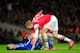 LONDON, ENGLAND - DECEMBER 23: Per Mertesacker of Arsenal helps Fernando Torres of Chelsea to his feet during the Barclays Premier League match between Arsenal and Chelsea at Emirates Stadium on December 23, 2013 in London, England. (Photo by Shaun Bott
