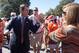 Clemson's Dabo Swinney rubbing elbows with fans.