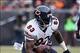 Dec 15, 2013; Cleveland, OH, USA; Chicago Bears tight end Martellus Bennett (83) tries to break free from Cleveland Browns strong safety T.J. Ward (43) during the second quarter at FirstEnergy Stadium. Mandatory Credit: Ron Schwane-USA TODAY Sports