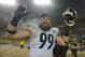 Dec 22, 2013; Green Bay, WI, USA; Pittsburgh Steelers defensive end Brett Keisel (99) reacts after the Steelers beat the Green Bay Packers 38-31 at Lambeau Field. Keisel recovered a fumble late in the 4th quarter to help set up the winning score. Mandato