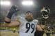 Dec 22, 2013; Green Bay, WI, USA; Pittsburgh Steelers defensive end Brett Keisel (99) reacts after the Steelers beat the Green Bay Packers 38-31 at Lambeau Field. Keisel recovered a fumble late in the 4th quarter to help set up the winning score. Mandato