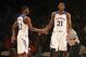 Nov 30, 2013; Paradise Island, BAHAMAS; Kansas Jayhawks guard Andrew Wiggins (22) and center Joel Embiid (21) react after a score during the game against the UTEP Miners at the 2013 Battle 4 Atlantis in the Imperial Arena at the Atlantis Resort. Mandatory