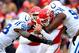 KANSAS CITY, MO - DECEMBER 22: Quarterback Alex Smith #11 of the Kansas City Chiefs is sacked by outside linebacker Robert Mathis #98 and defensive end Cory Redding #90 of the Indianapolis Colts during the game at Arrowhead Stadium on December 22, 2013 i