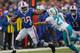 ORCHARD PARK, NY - DECEMBER 22: C.J. Spiller #28 of the Buffalo Bills runs against Brent Grimes #21 of the Miami Dolphins at Ralph Wilson Stadium on December 22, 2013 in Orchard Park, New York. Buffalo won 16-0. (Photo by Rick Stewart/Getty Images)
