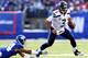 EAST RUTHERFORD, NJ - DECEMBER 15: Russell Wilson #3 of the Seattle Seahawks scrambles as Terrell Thomas #24 of the New York Giants misses the tackle at MetLife Stadium on December 15, 2013 in East Rutherford, New Jersey. (Photo by Elsa/Getty Images)