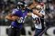 Dec 22, 2013; Baltimore, MD, USA; Baltimore Ravens wide receiver Torrey Smith (82) gives a stiff arm to New England Patriots safety Steve Gregory (28) at M&T Bank Stadium. Mandatory Credit: Evan Habeeb-USA TODAY Sports