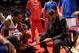 AUBURN HILLS, MI - DECEMBER 21: Maurice Cheeks of the Detroit Pistons talks with Brandon Jennings #7 during a timeout against the Houston Rockets on December 21, 2013 at The Palace of Auburn Hills in Auburn Hills, Michigan. NOTE TO USER: User expressly a