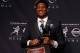 NEW YORK, NY - DECEMBER 14: Jameis Winston, quarterback of the Florida State Seminoles, poses with the trophy during a press conference after the 2013 Heisman Trophy Presentation at the Marriott Marquis on December 14, 2013 in New York City. (Photo by J
