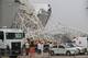 SAO PAULO, BRAZIL - NOVEMBER 27: Personnel survey the damage at the site of a crane collapse during construction at Itaquerao Stadium on November 27, 2013 in Sao Paulo, Brazil. According to reports, at least two workers were killed in the accident which