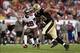 Sep 15, 2013; Tampa, FL, USA; Tampa Bay Buccaneers cornerback Leonard Johnson (29) defends New Orleans Saints tight end Jimmy Graham (80) during the game at Raymond James Stadium. Mandatory Credit: Rob Foldy-USA TODAY Sports