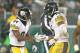 GREEN BAY, WI - DECEMBER 22: Le'Veon Bell #26 of the Pittsburgh Steelers celebrates his game-winning touchdown with teammate Antonio Brown #84 against the Green Bay Packers at Lambeau Field on December 22, 2013 in Green Bay, Wisconsin. The Steelers defea