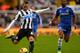 NEWCASTLE UPON TYNE, ENGLAND - NOVEMBER 02: Ashley Cole of Chelsea closes down Yohan Cabaye of Newcastle United during the Barclays Premier League match between Newcastle United and Chelsea at St James' Park on November 2, 2013 in Newcastle upon Tyne, En