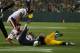 GREEN BAY, WI - NOVEMBER 04: Aaron Rodgers #12 of the Green Bay Packers is sacked by Shea McClellin #99 of the Chicago Bears with an assist from Isaiah Frey #31 at Lambeau Field on November 4, 2013 in Green Bay, Wisconsin. (Photo by Jonathan Daniel/Gett