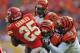KANSAS CITY, MO - NOVEMBER 18: Defenders Taylor Mays #26 and Wallace Gilberry #95 of the Cincinnati Bengals tackle running back Jamaal Charles #25 of the Kansas City Chiefs during the second half on November 18, 2012 at Arrowhead Stadium in Kansas City,