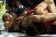 March 3, 2012; Columbus, OH, USA; Ronda Rousey gets Miesha Tate in an armbar during the Strikeforce Grand Prix final at Nationwide Arena. Mandatory Credit: Greg Bartram-USA TODAY Sports
