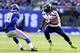 EAST RUTHERFORD, NJ - DECEMBER 15: Marshawn Lynch #24 of the Seattle Seahawks carries the ball as Prince Amukamara #20 of the New York Giants defends at MetLife Stadium on December 15, 2013 in East Rutherford, New Jersey. (Photo by Elsa/Getty Images)