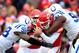 KANSAS CITY, MO - DECEMBER 22: Quarterback Alex Smith #11 of the Kansas City Chiefs is sacked by outside linebacker Robert Mathis #98 and defensive end Cory Redding #90 of the Indianapolis Colts during the game at Arrowhead Stadium on December 22, 2013 i