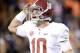 Nov 30, 2013; Auburn, AL, USA; Alabama Crimson Tide quarterback AJ McCarron (10) celebrates after a 99 yard touchdown by wide receiver Amari Cooper (not pictured) against the Auburn Tigers during the fourth quarter at Jordan Hare Stadium. Mandatory Credit