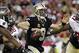 Sep 15, 2013; Tampa, FL, USA; New Orleans Saints quarterback Drew Brees (9) scrambles during the first half against the Tampa Bay Buccaneers at Raymond James Stadium. Mandatory Credit: Kim Klement-USA TODAY Sports