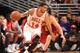 CHICAGO, IL - DECEMBER 21: D.J. Augustin #14 of the Chicago Bulls drives against the Cleveland Cavaliers on December 21, 2013 at the United Center in Chicago, Illinois. NOTE TO USER: User expressly acknowledges and agrees that, by downloading and/or using