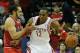 HOUSTON, TX - DECEMBER 18: Dwight Howard #12 of the Houston Rockets is grabbed unber the basket by Joakim Noah #13 of the Chicago Bulls during the game at Toyota Center on December 18, 2013 in Houston, Texas. NOTE TO USER: User expressly acknowledges an