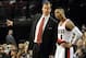 Dec 21, 2013; Portland, OR, USA; Portland Trail Blazers head coach Terry Stotts speaks with point guard Damian Lillard (0) during the fourth quarter of the game against the New Orleans Pelicans at the Moda Center. The Blazers won the game 110-107. Mandato