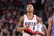 PORTLAND, OR - DECEMBER 4: Damian Lillard #0 of the Portland Trailblazers looks on against the Oklahoma City Thunder on December 4, 2013 at the Moda Center Arena in Portland, Oregon. NOTE TO USER: User expressly acknowledges and agrees that, by downloadin