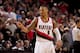 PORTLAND, OR - DECEMBER 2: Damian Lillard #0 of the Portland Trail Blazers celebrates a play against the Indiana Pacers on December 2, 2013 at the Moda Center Arena in Portland, Oregon. NOTE TO USER: User expressly acknowledges and agrees that, by downlo