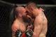 Apr 27, 2013; Newark, NJ, USA; Jim Miller (left) competes against Pat Healy (right) during UFC 159 at the Prudential Center. Mandatory Credit: Brad Penner-USA TODAY Sports