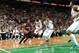 BOSTON, MA - JANUARY 14: Kemba Walker #15 of the Charlotte Bobcats drives against Kevin Garnett #5 and Rajon Rondo #9 of the Boston Celtics on January 14, 2013 at the TD Garden in Boston, Massachusetts. NOTE TO USER: User expressly acknowledges and agre