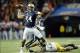 Dec 7, 2013; Atlanta, GA, USA; Auburn Tigers quarterback Nick Marshall (14) passes the ball in spite of the defense of Missouri Tigers defensive lineman Harold Brantley (90) during the second quarter of the 2013 SEC Championship game at Georgia Dome. Mand