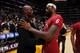 LOS ANGELES, CA - DECEMBER 25: Kobe Bryant #24 of the Los Angeles Lakers and LeBron James #6 of the Miami Heat converse after a game at STAPLES Center on December 25, 2013 in Los Angeles, California. NOTE TO USER: User expressly acknowledges and agrees th