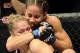 Feb 23, 2013; Anaheim, CA, USA; Ronda Rousey (red gloves) and Liz Carmouche (blue gloves) during their UFC women's world bantamweight championship bout at the Honda Center. Mandatory Credit: Jayne Kamin-Oncea-USA TODAY Sports