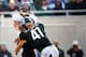 November 17, 2012; East Lansing, MI, USA; Northwestern Wildcats quarterback Trevor Siemian (13) has his throw hurried by Michigan State Spartans linebacker Kyler Elsworth (41 )during the 2nd half of a game at Spartan Stadium. Northwestern won 23-20.