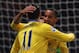 LONDON, ENGLAND - DECEMBER 26: Theo Walcott of Arsenal (R) celebrates with Mesut Oezil (11) as he scores their first goal during the Barclays Premier League match between West Ham United and Arsenal at Boleyn Ground on December 26, 2013 in London, Englan