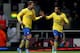 LONDON, ENGLAND - DECEMBER 26: Lukas Podolski of Arsenal (L) celebrates with Theo Walcott as he scores their third goal during the Barclays Premier League match between West Ham United and Arsenal at Boleyn Ground on December 26, 2013 in London, England.