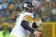 GREEN BAY, WI - DECEMBER 22: Ben Roethlisberger #7 of the Pittsburgh Steelers looks for a receiver against the Green Bay Packers at Lambeau Field on December 22, 2013 in Green Bay, Wisconsin. (Photo by Jonathan Daniel/Getty Images)